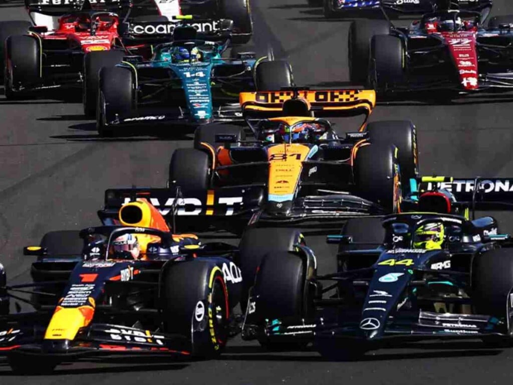 Max Verstappen overtaking Lewis Hamilton into turn 1 