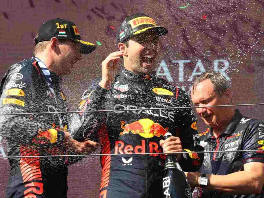 Red Bull plans to use AI to boost F1 car performance 1 Red Bull drivers Max Verstappen and Sergio Perez celebrating on the Hungarian GP podium (image via South China Morning Post)