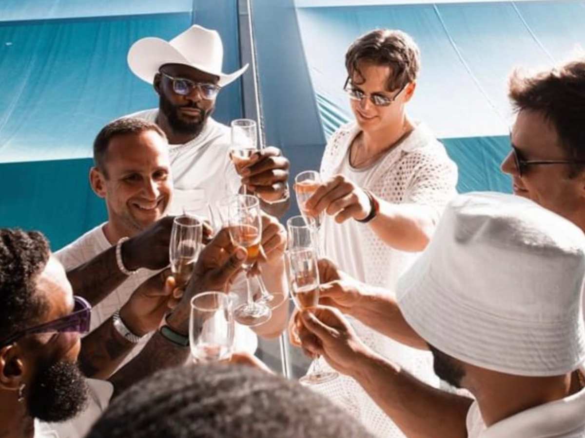 Bengals QB Joe Burrow spotted sipping champagne with $300,000,000 worth Tom Brady at $11,000,000,000 worth Michael Rubin’s White Party