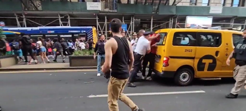 Watch: NYPD officer smashes a kid's head through a car windshield during Kai Cenat-Union Square Park riot