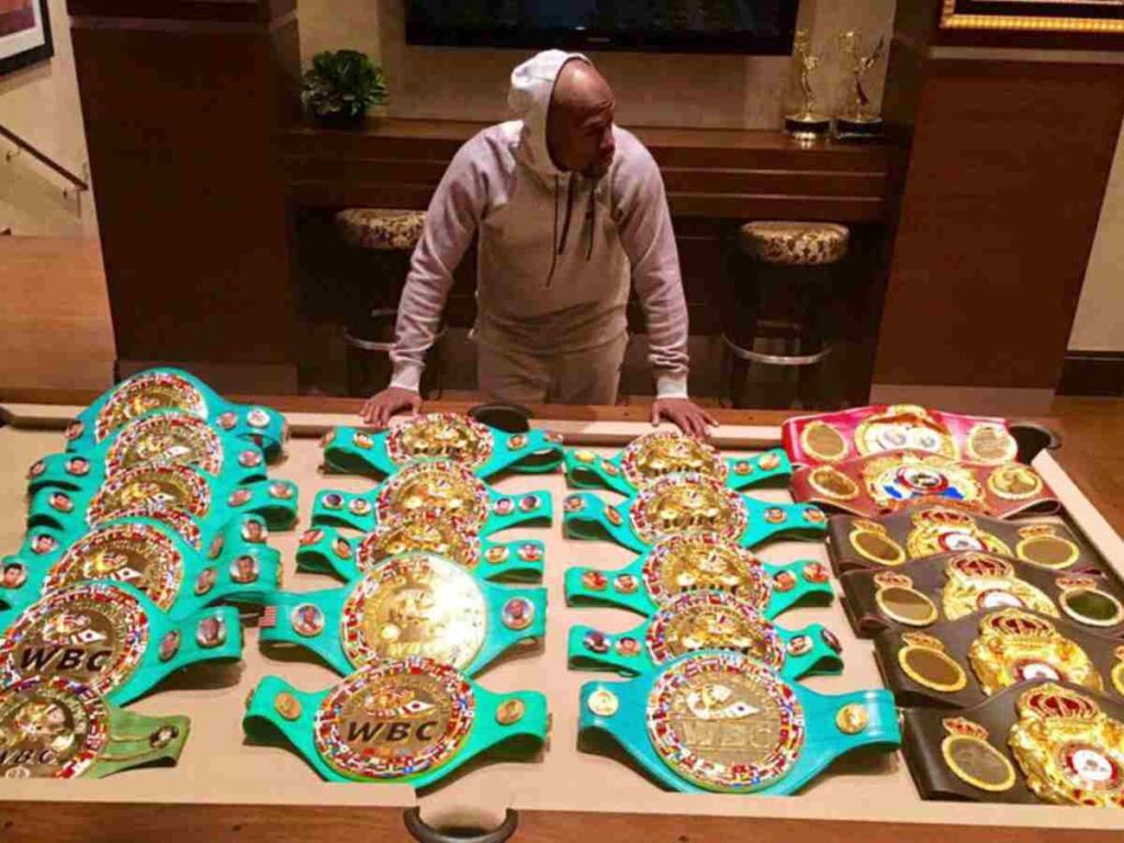 Floyd Mayweather with his belts