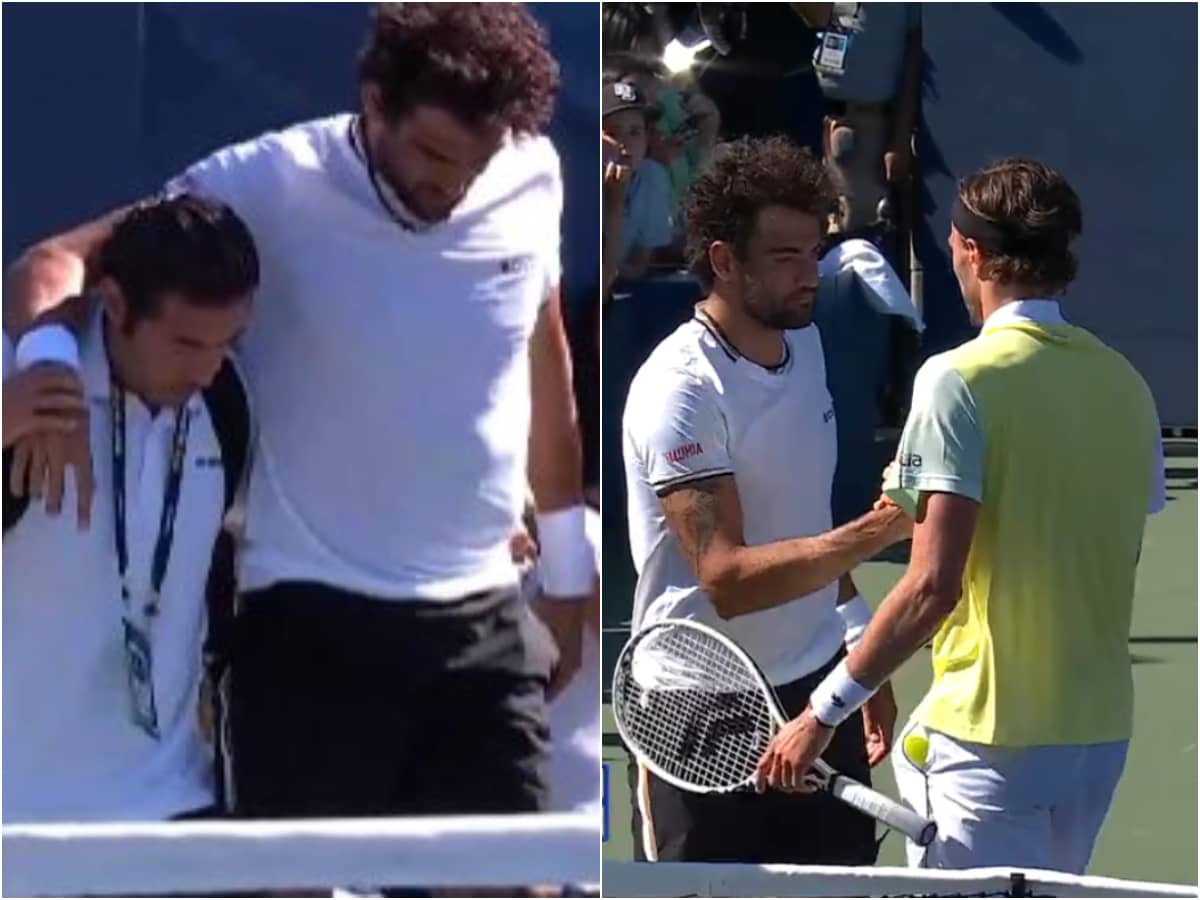 Matteo Berrettini helped by his trainer before informing Arthur Rinderknech and the umpire of his forfeit