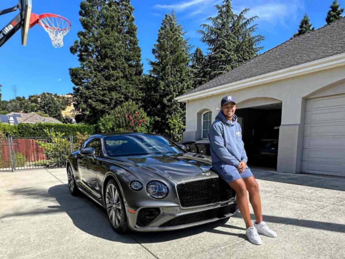 Lance with his Bentley car