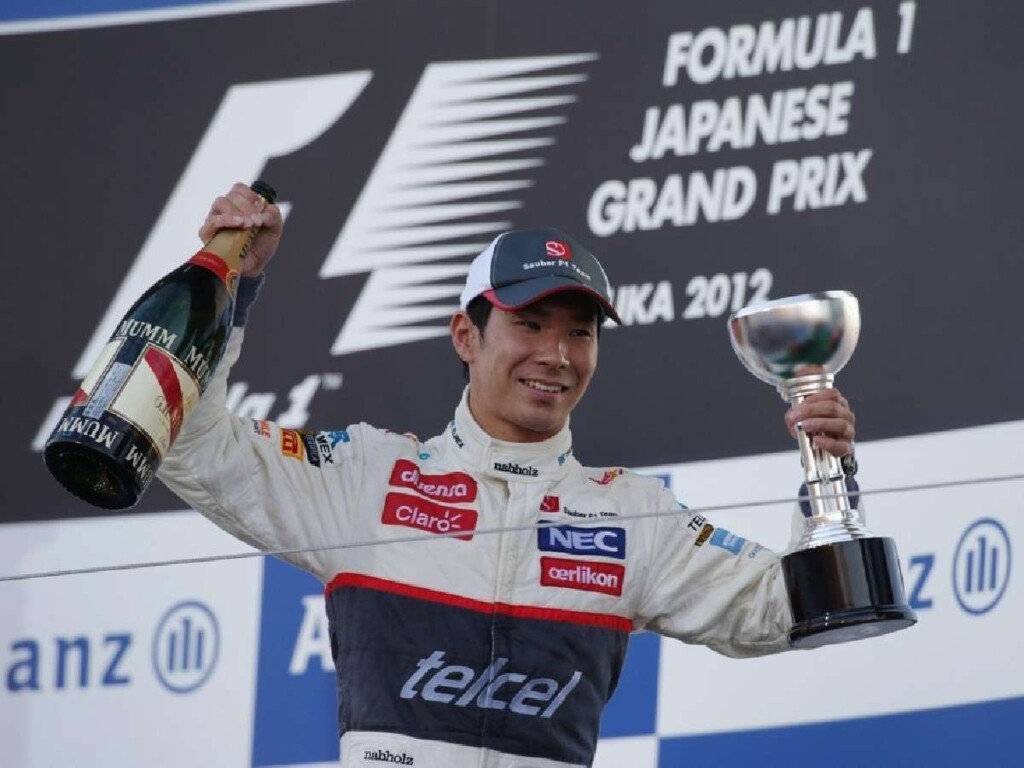 Kamui Kobayashi on a podium