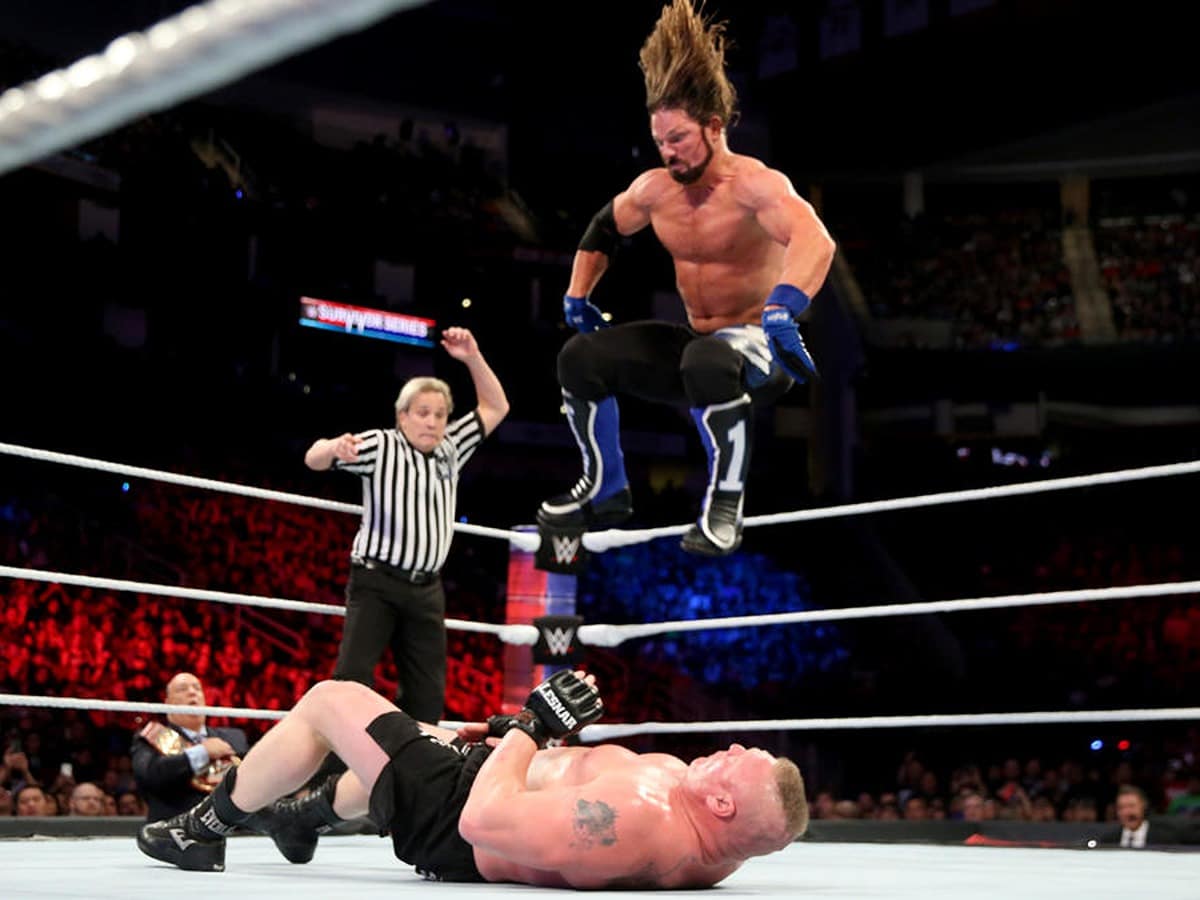 AJ Styles performing the springboard 450 splash on Brock Lesnar