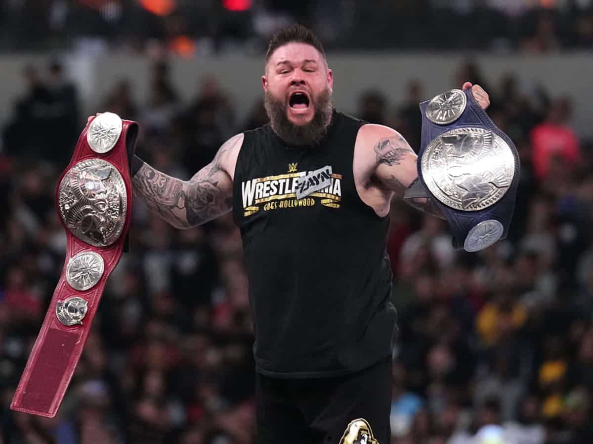 Kevin Owens with the tag titles