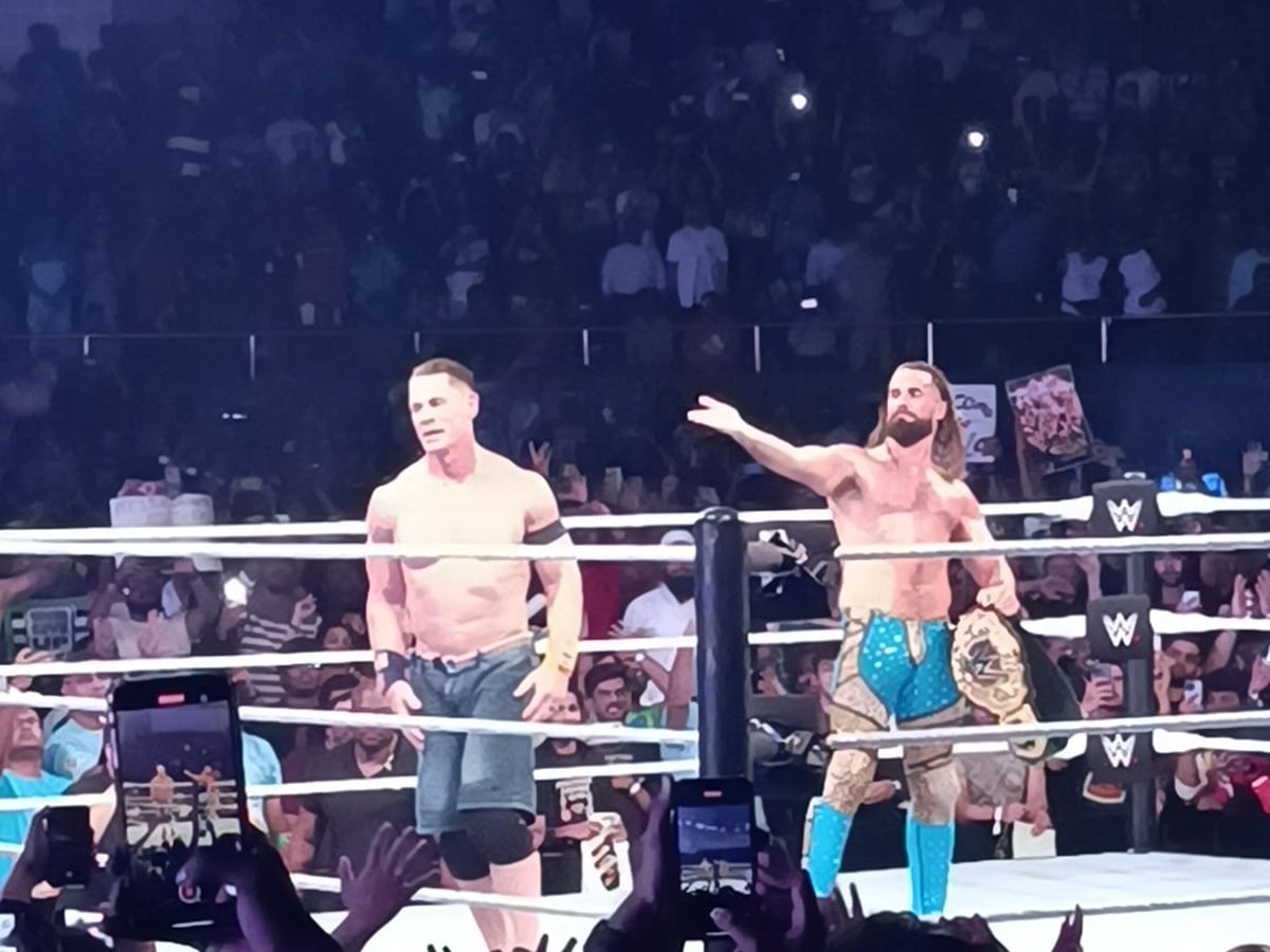 John Cena and Seth Rollins celebrating their win