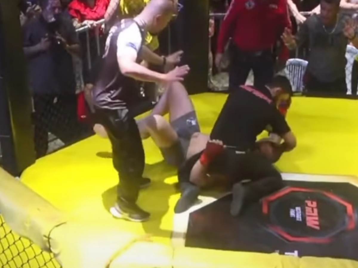 WATCH: Crazy MMA fighter shoves referee aside to continue throwing ‘bombs’ on opponent