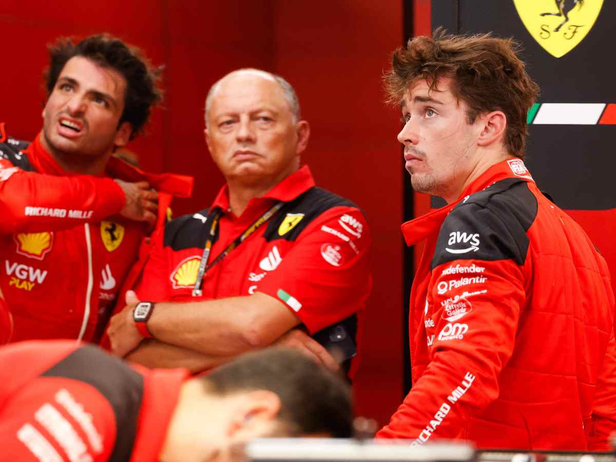 Carlos Sainz, Fred Vasseur and Charles Leclerc in the Ferrari garage.