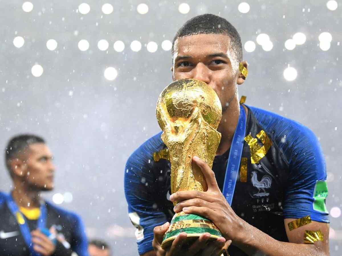 PSG star Kylian Mbappe kisses the World Cup 