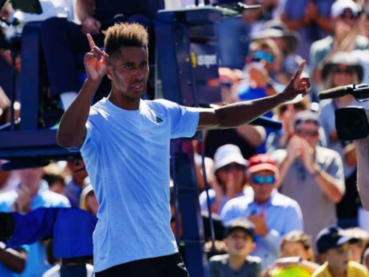 Michael Mmoh celebrates match point against John Isner on day four of the 2023 U.S. Open (via Imago)