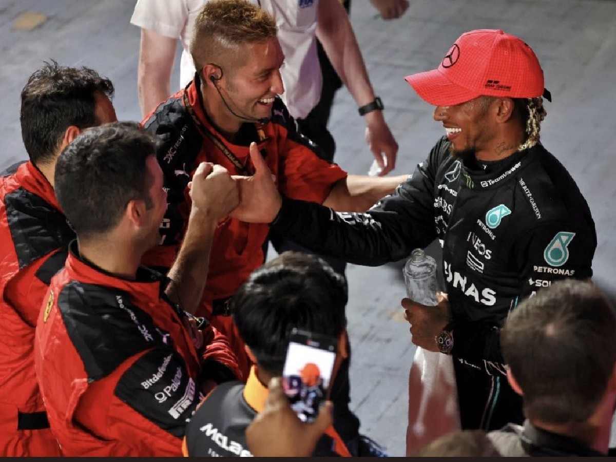 Lewis Hamilton being congratulated by Ferrari after Mercedes failed to show up