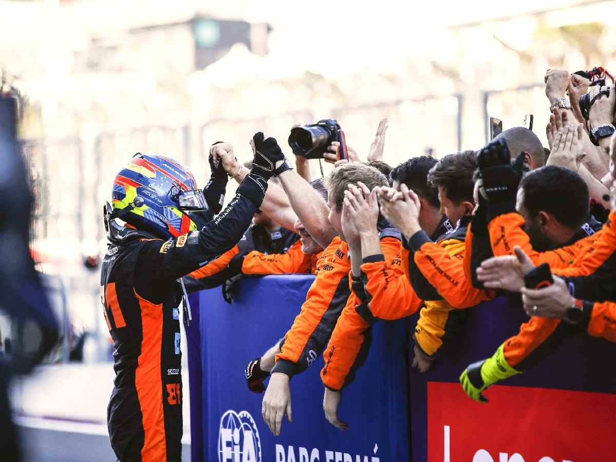 Oscar Piastri celebrates his Japanese GP podium with the McLaren crew 