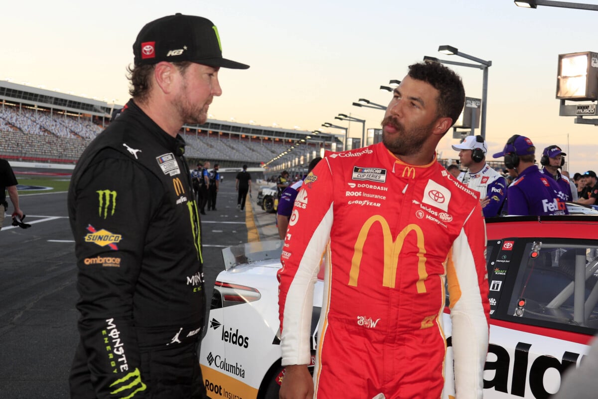 CHARLOTTE, NC MAY 28: Kurt Busch ( 45 23XI Racing Monster Energy Toyota) talks with team mate Bubba Wallace ( 23 23XI