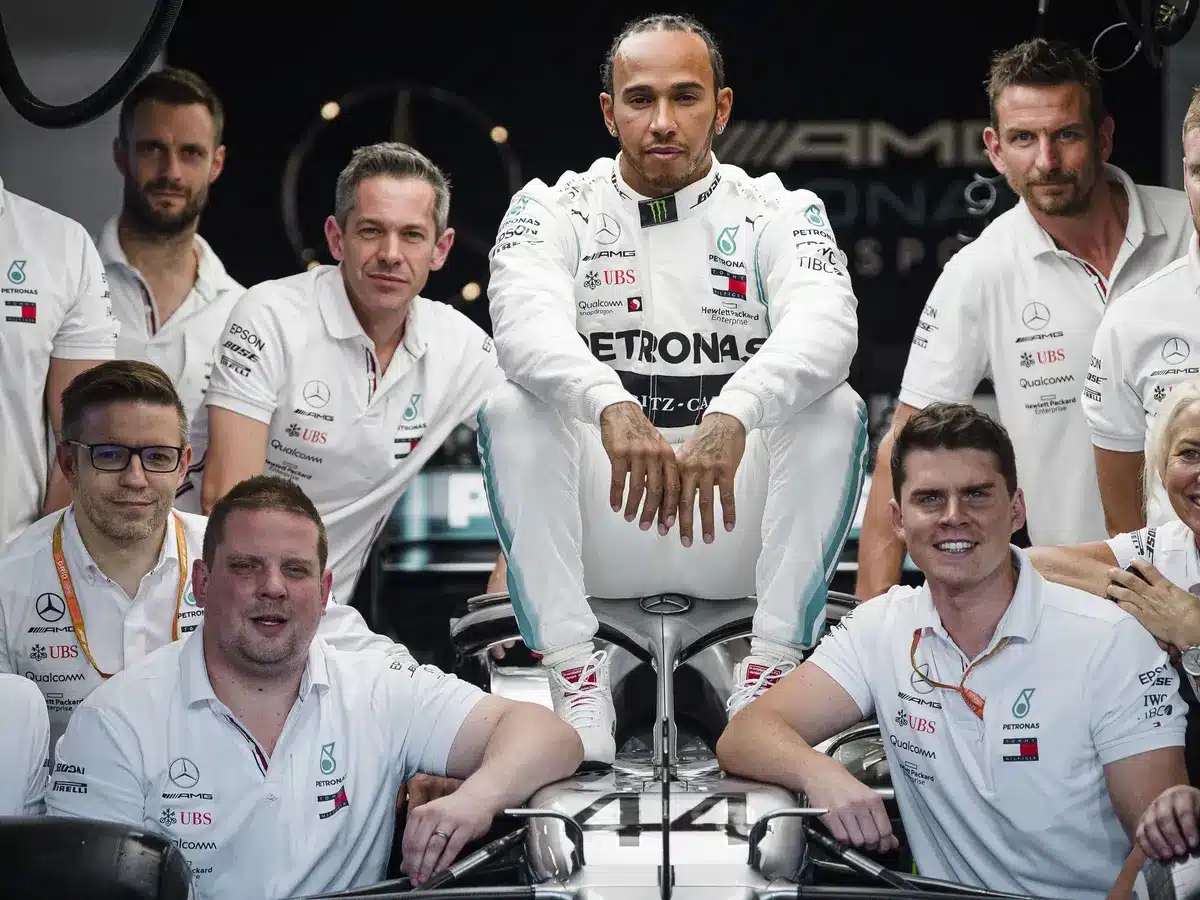 Lewis Hamilton with his team