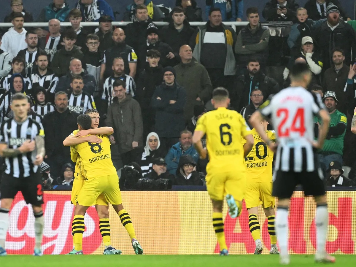 Dortmund players celebrating after scoring against Newcastle