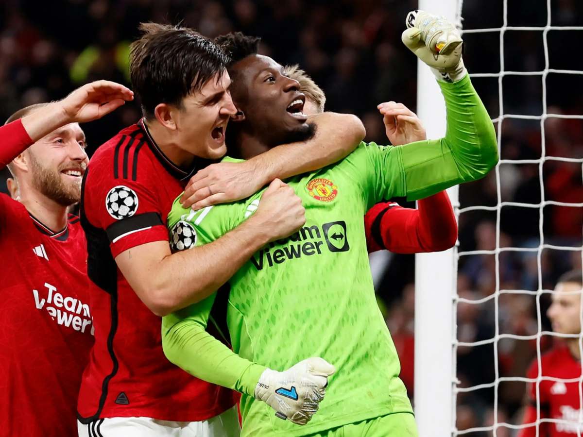 Harry Maguire and Andre Onana celebrating.