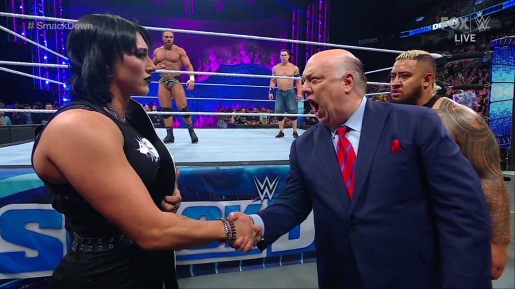 Rhea Ripley and Paul Heyman shake hands 