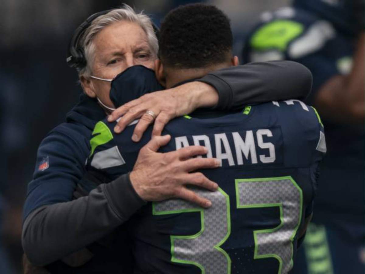 Pete Carroll hugging Jamal Adams