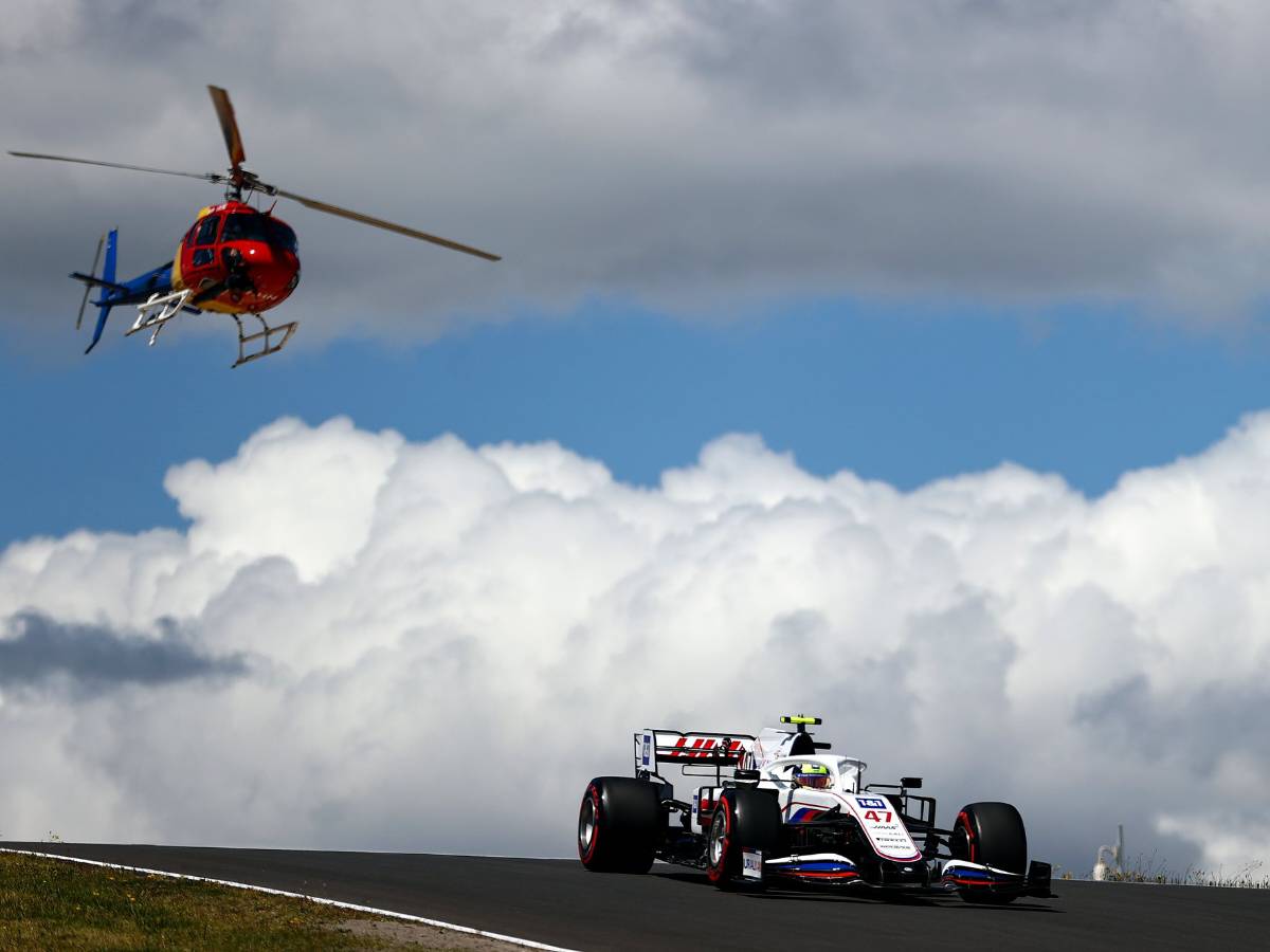 F1 helicopter behind the Haas VF22 