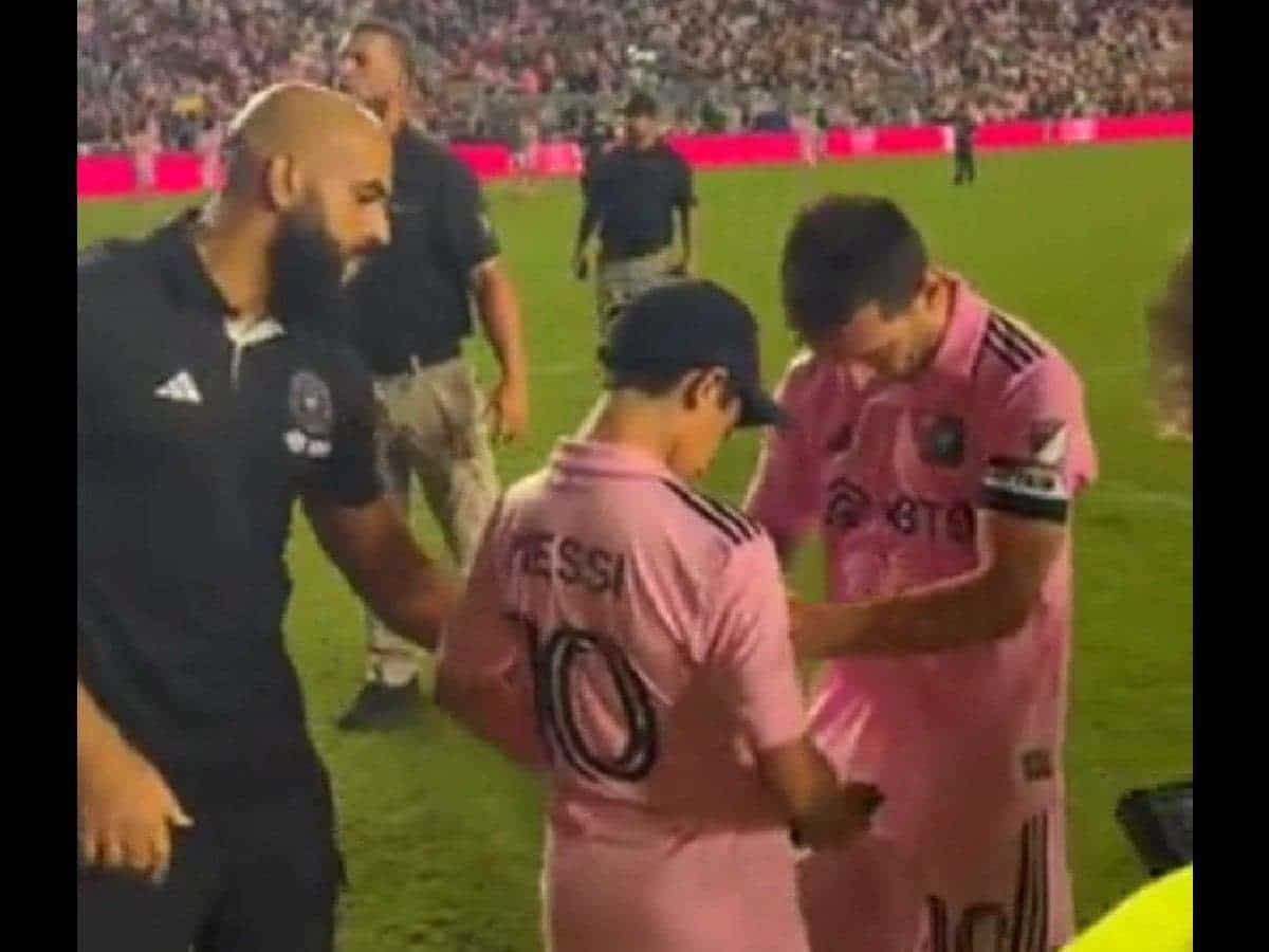 WATCH: Lionel Messi’s Bodyguard makes TACKLE on young fan before letting him take a SELFIE with Lionel Messi