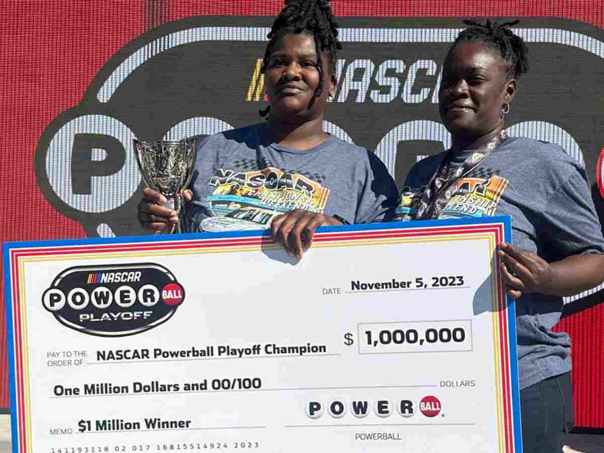 Stephanie Walker holding the $1 Million check from Powerball