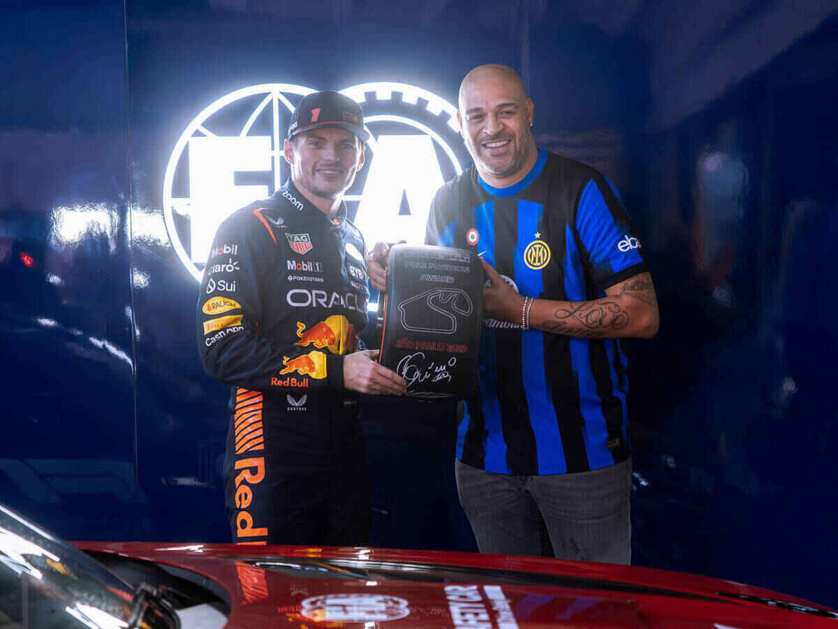 “What is the fake R9 doing with the goat of racing?”- Fans react as controversial Brazilian football icon Adriano awards the pole position trophy to Max Verstappen at Interlagos