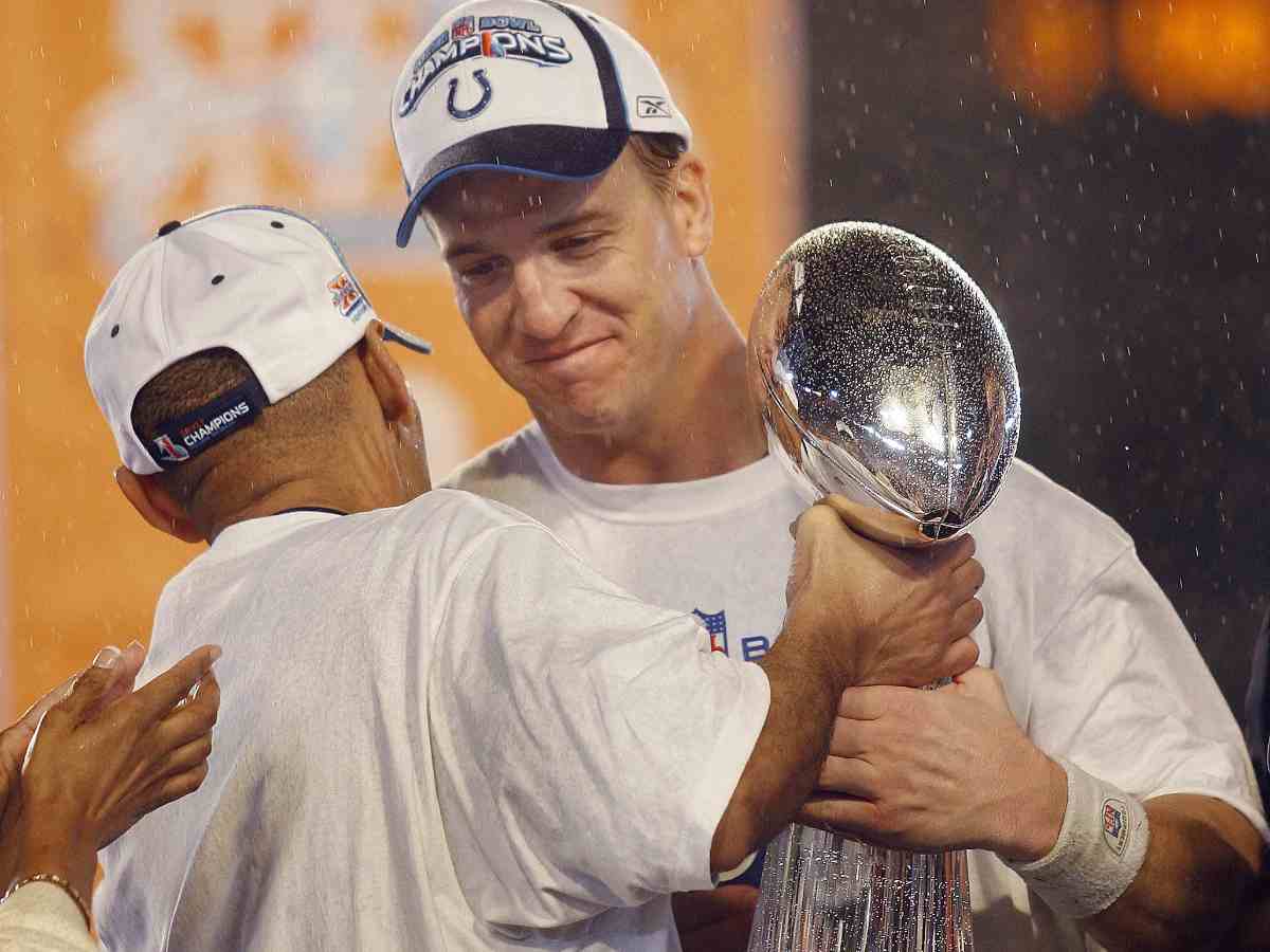 Peyton Mannings holding Super Bowl trophy