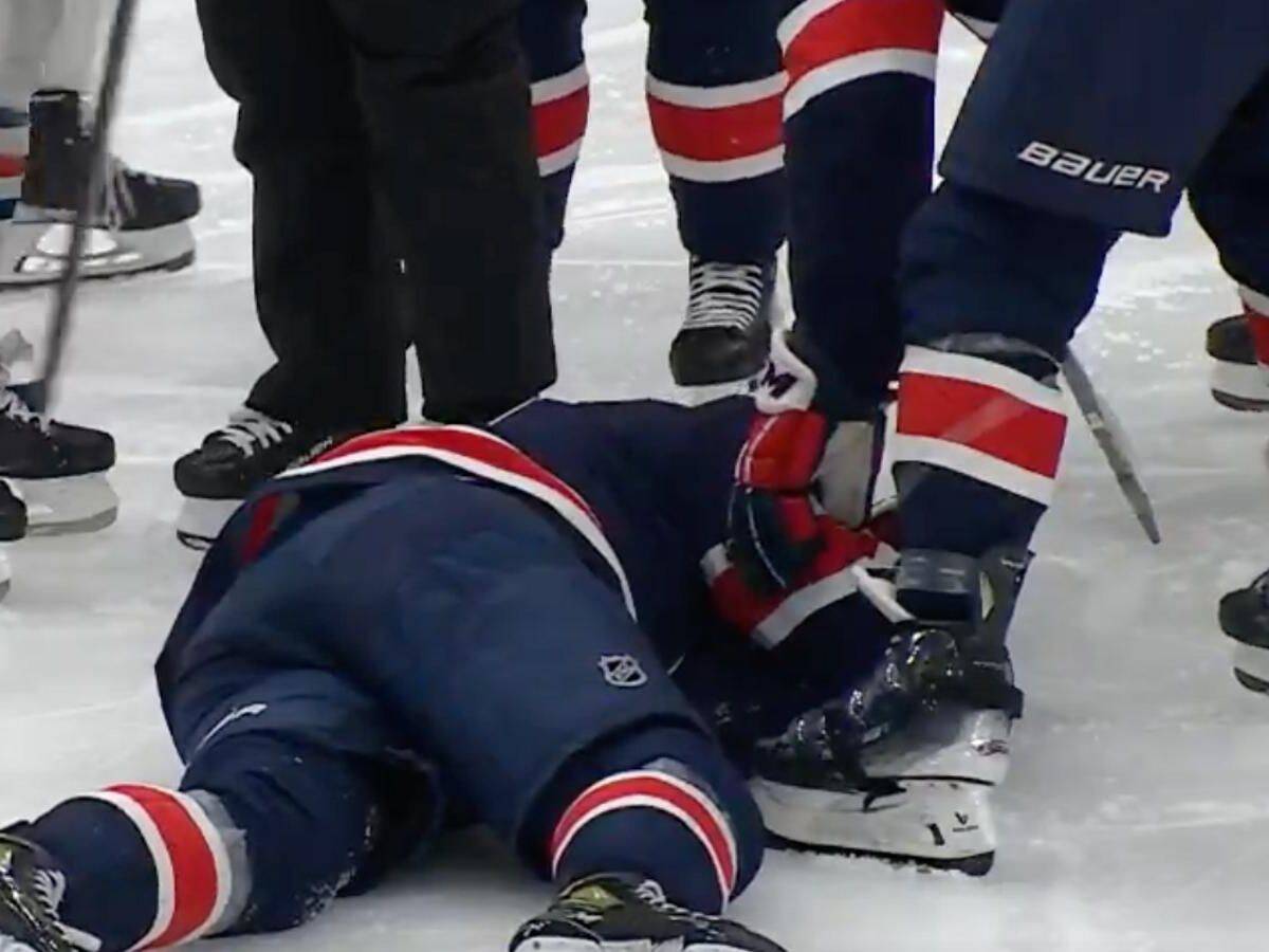 T.J. Oshie lays down after crash with Mattias Ekholm [Image Credit: Hockey Feed]