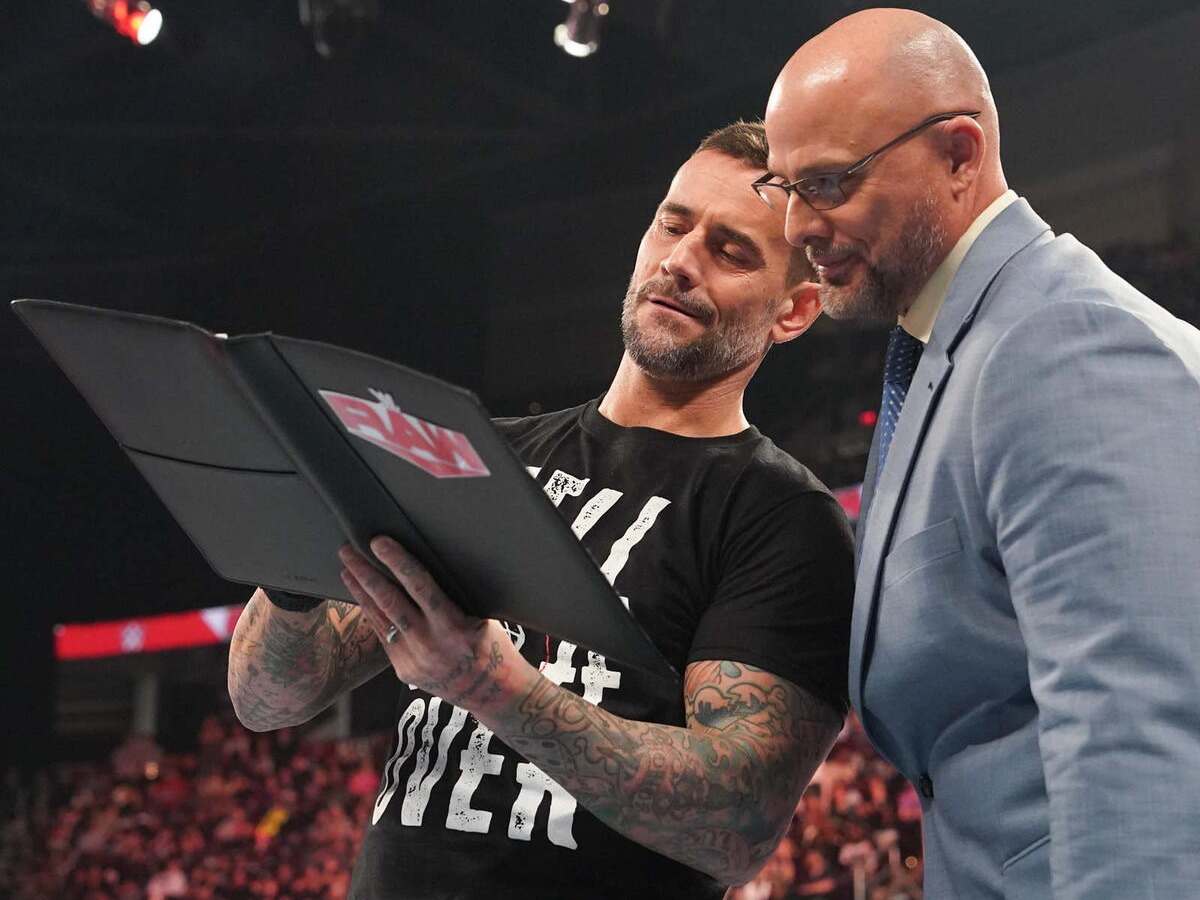 CM Punk and Adam Pearce