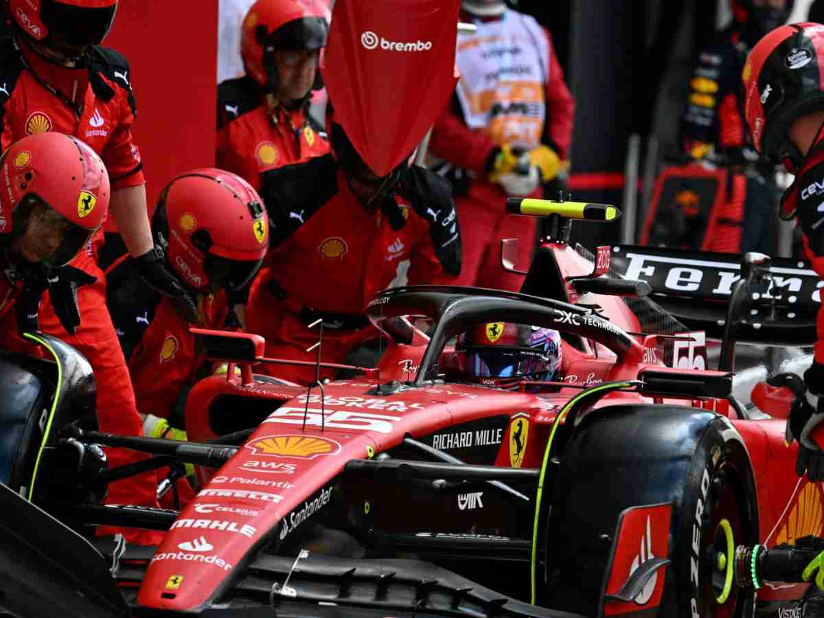 Carlos Sainz's SF23 being wheeled in to the Ferrari garage