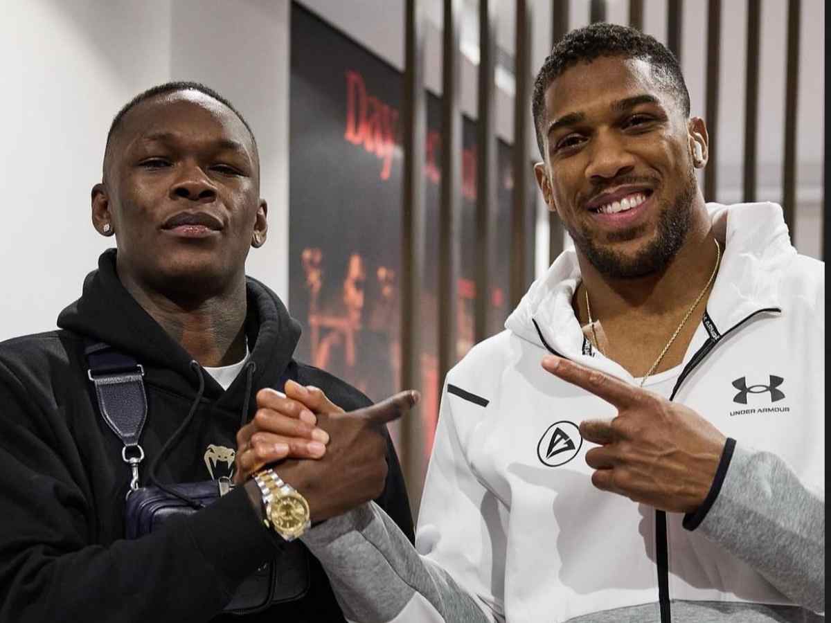 Israel Adesanya meets with Anthony Joshua, ahead of his victory