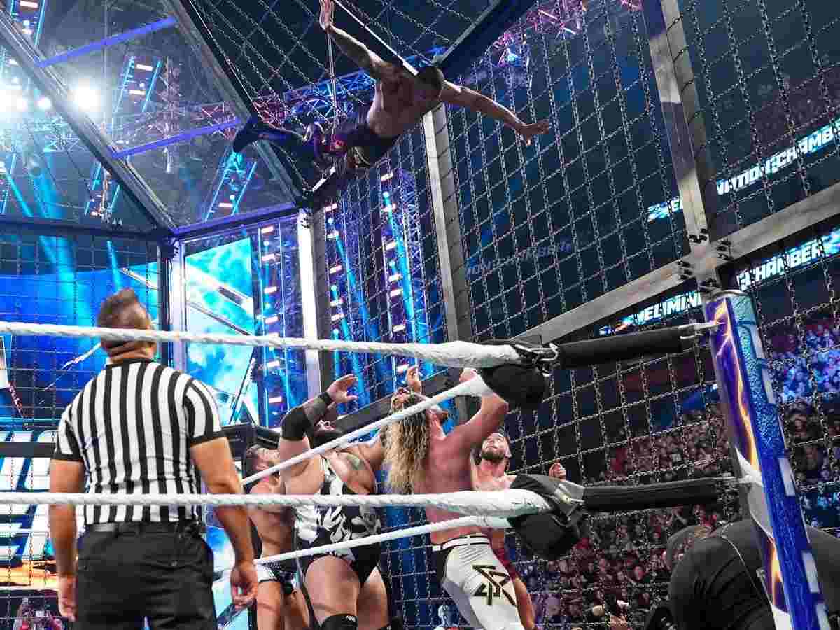 Montez Ford diving from top of the Elimination Chamber