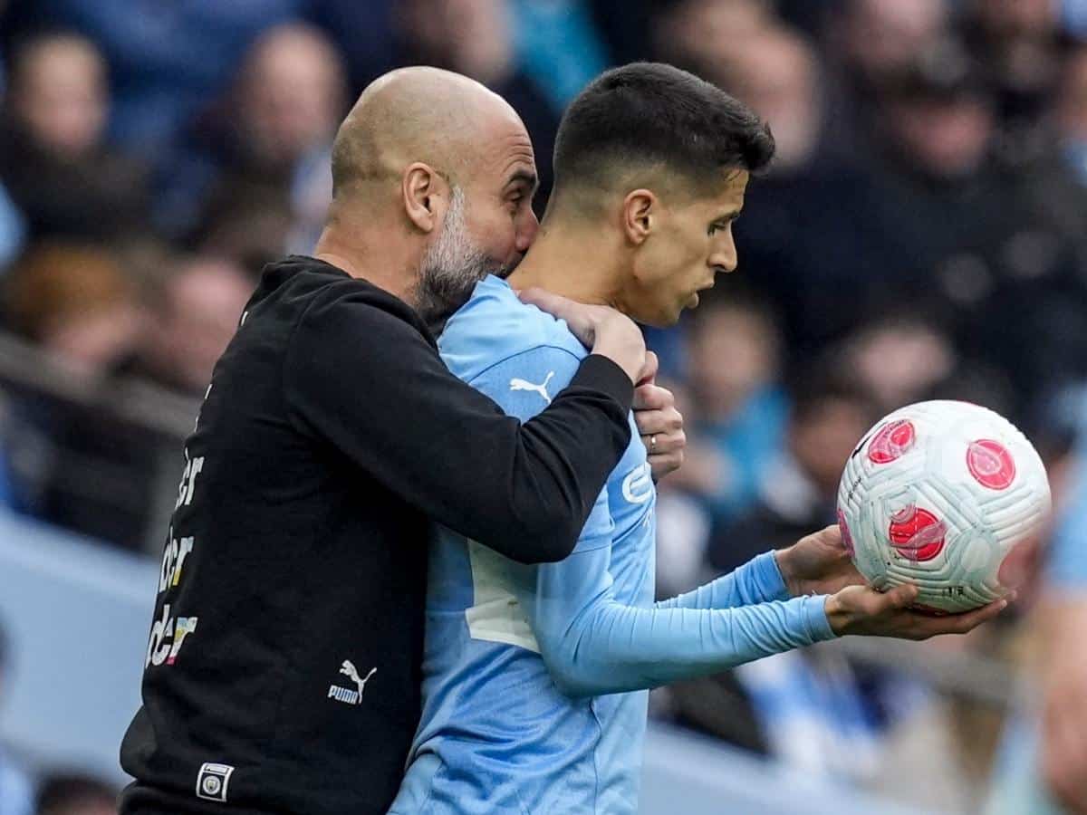 Pep Guardiola and Joao Cancelo 