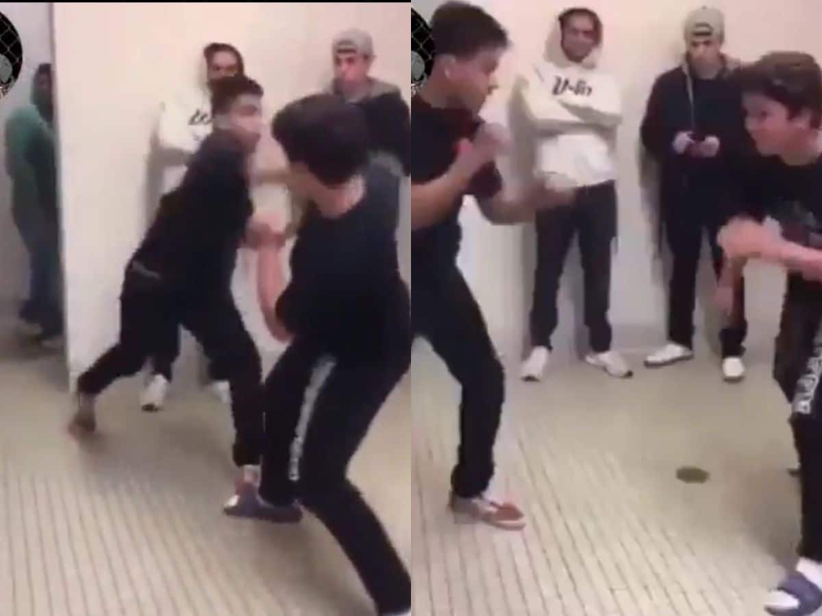 Guys fighting in a bathroom 