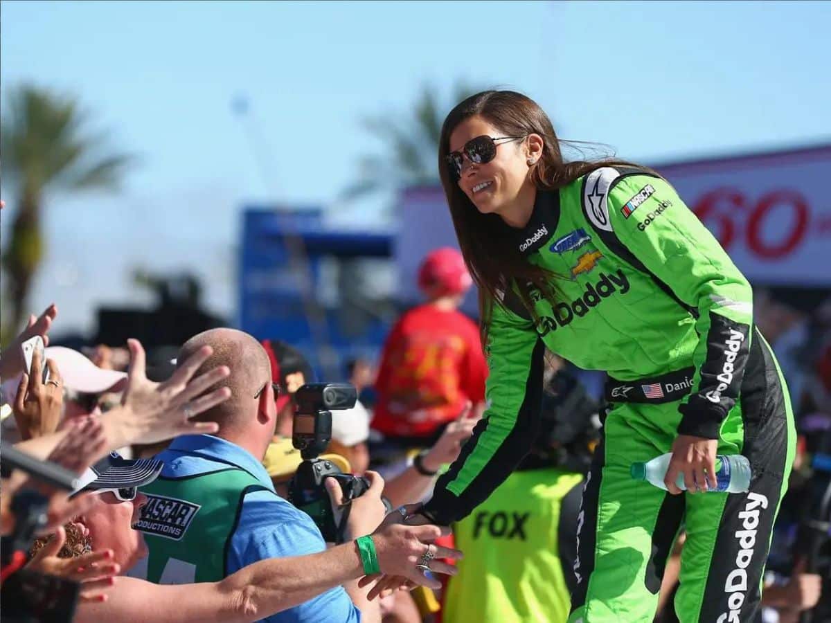 Danica Patrick high-fiving her fans