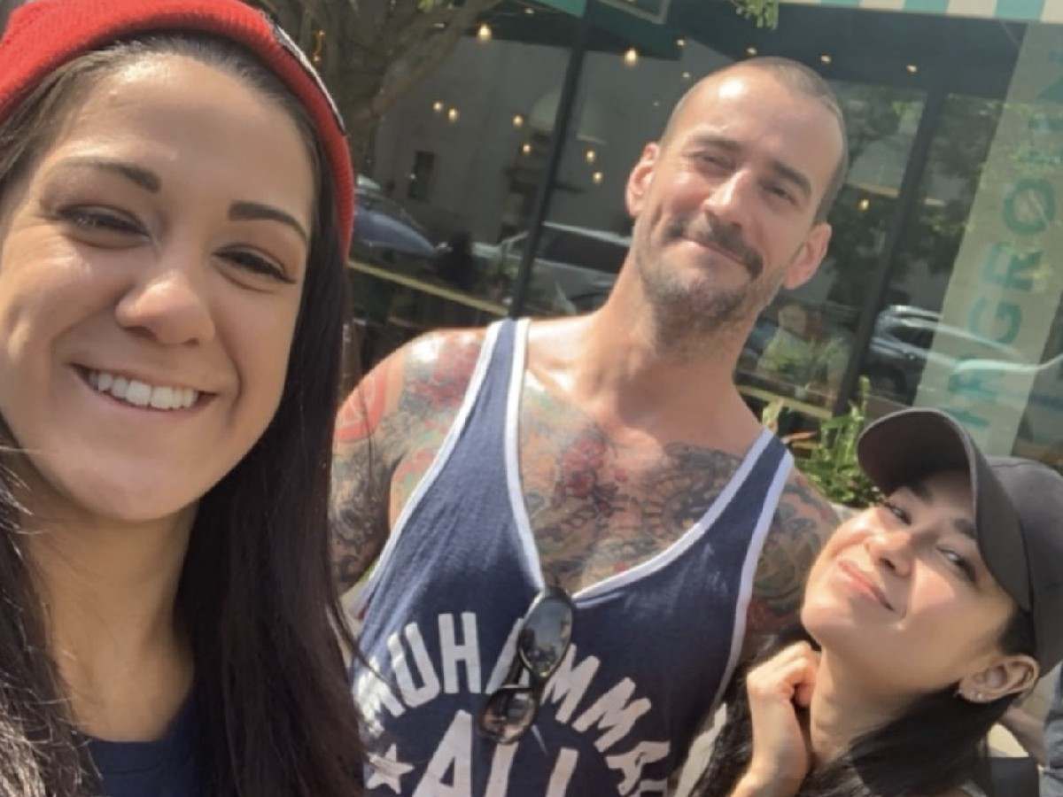 Bayley, CM Punk and AJ Lee