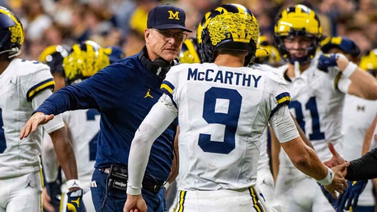 WATCH: “Go finish the job!” – Alabama OL Tyler Booker’s special message to ex-teammate and Michigan QB J.J. McCarthy while sharing an intimate hug after Rose Bowl goes viral
