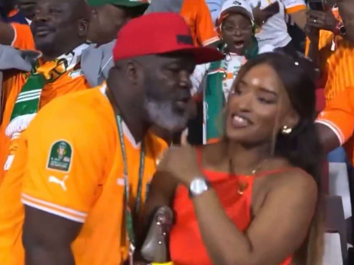 WATCH: “AFCON Wild Fr” – Fans laugh as OVER-ENTHUSIASTIC ‘uncle’ caught whispering in woman’s ear during Ivory Coast’s celebrations