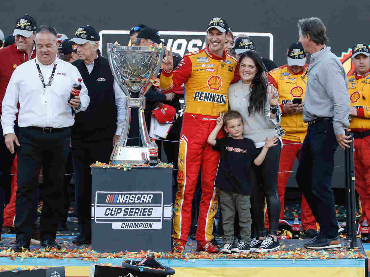 Joey Logano and family celibrating 2022 championship triumph.