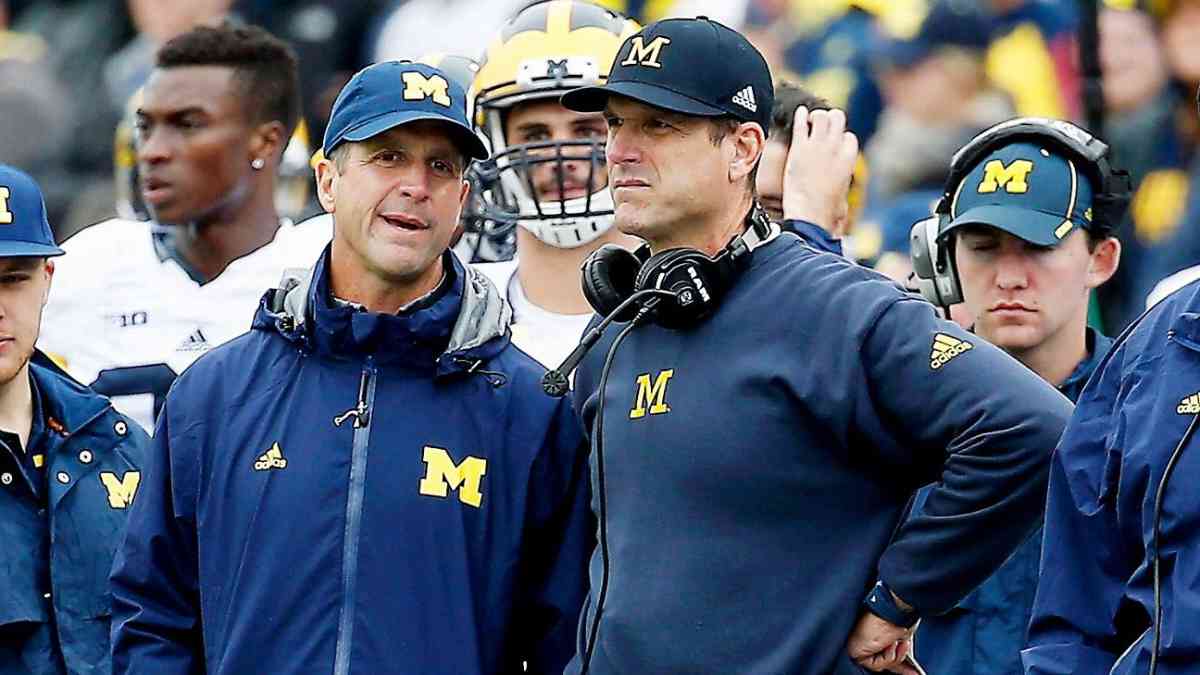 How is Ravens HC John Harbaugh related to Michigan HC Jim Harbaugh?