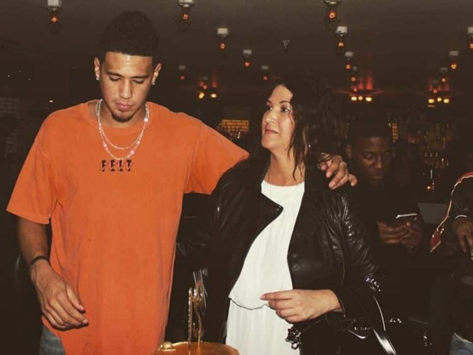 Who are Devin Booker's parents, Veronica Gutierrez and Melvin Booker?