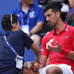 Novak Djokovic with physiotherapist 