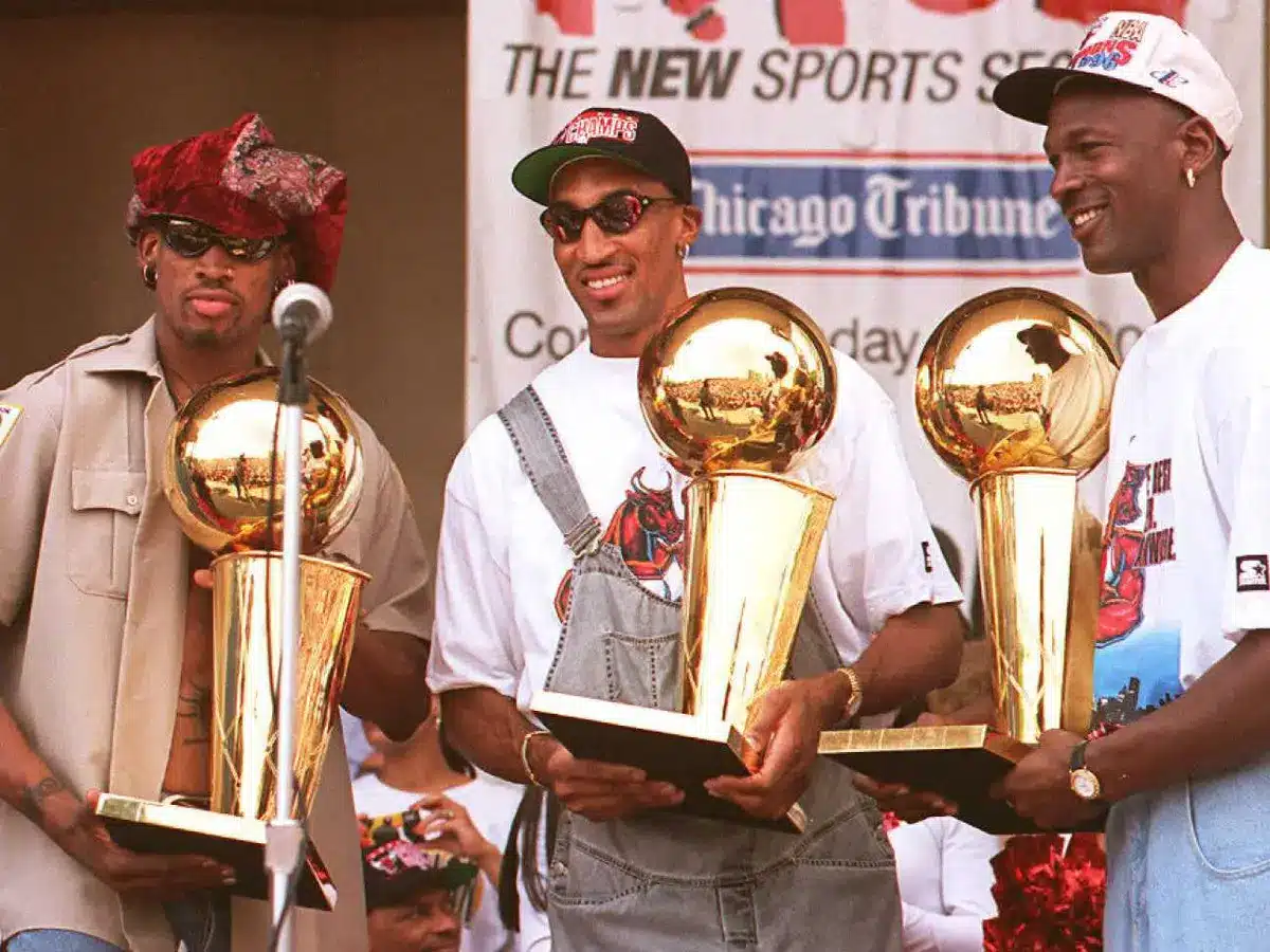 Dennis Rodman, Scottie Pippen and Michael Jordan celebrate their three-peat