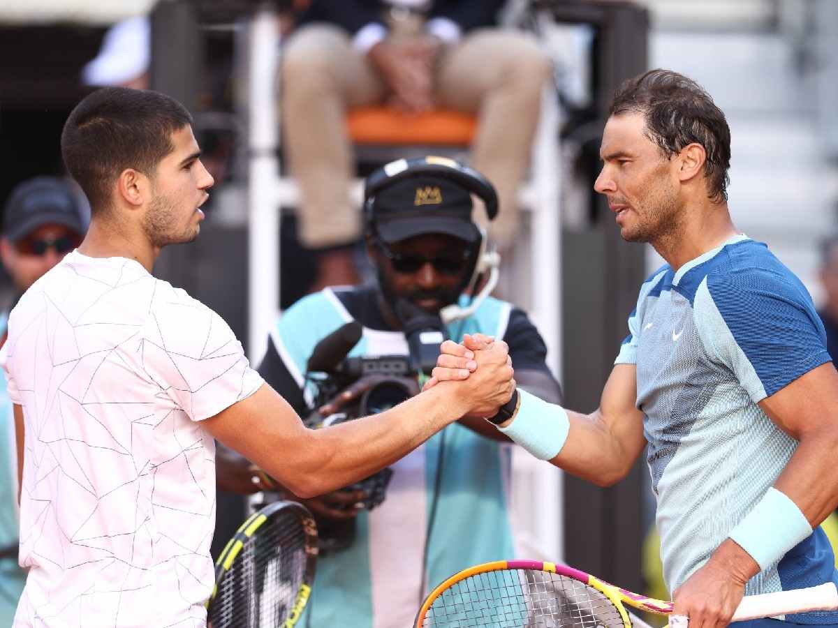 Carlos Alcaraz of Spain saludates to Rafael Nadal of Spain after winning during the Mutua Madrid Open 2022 celebrated at La Caja Magica.