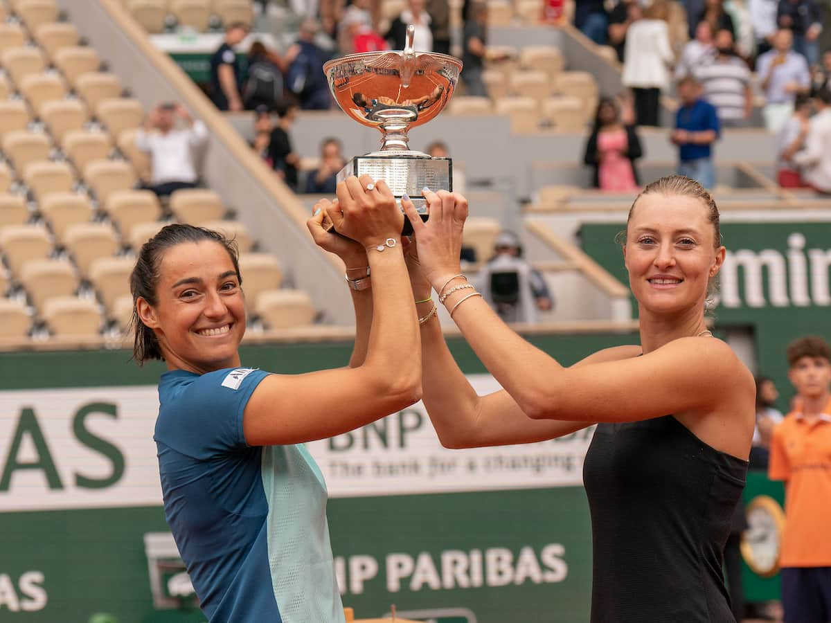 Caroline Garcia Kristina Mladenovic with the 2022 French Open trophy