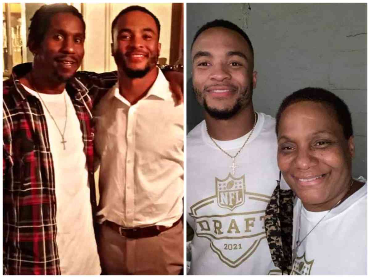 Elijah Mitchell with his brother (R) and his mother 