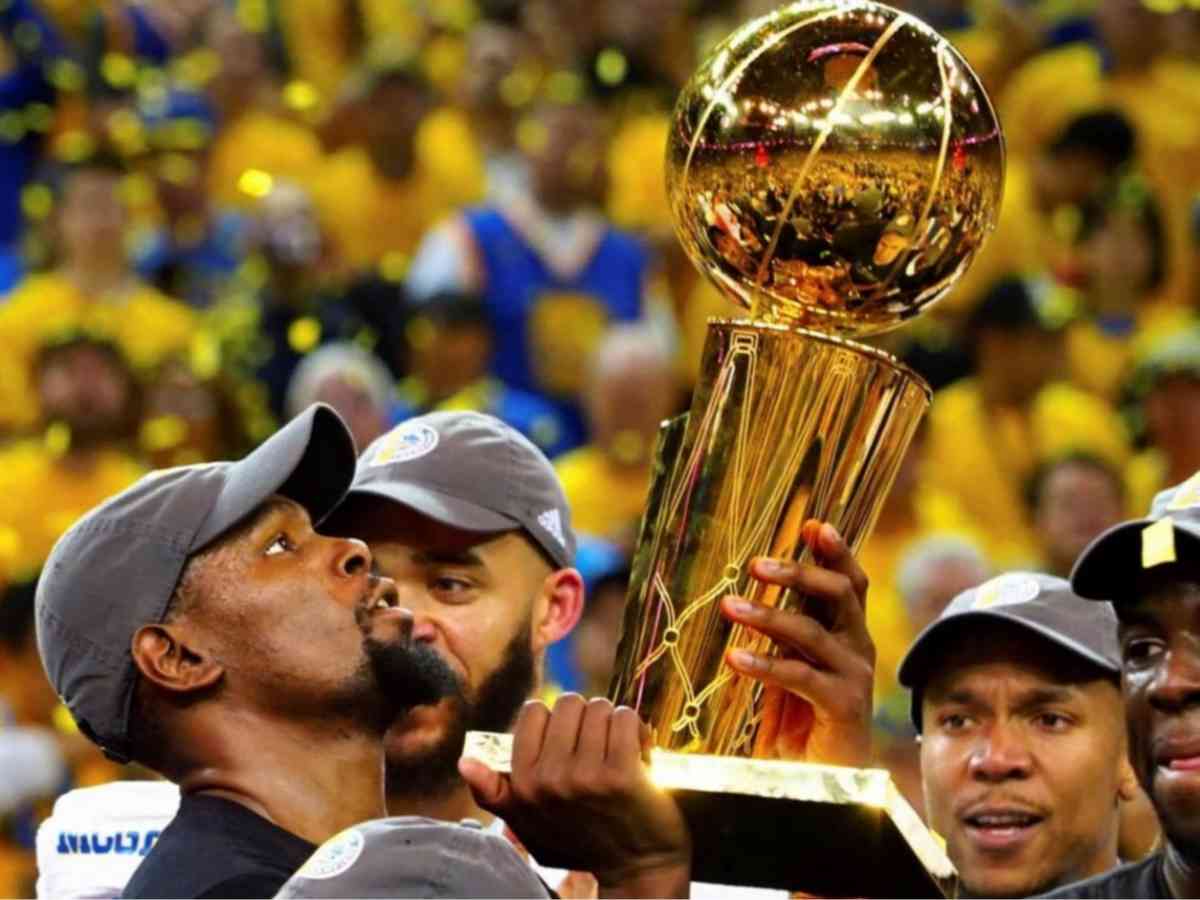 Kevin Durant lifting NBA Championship trophy