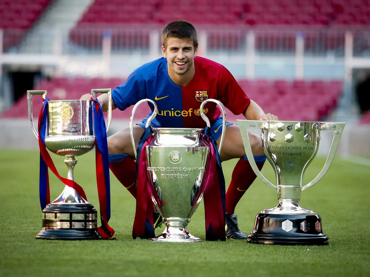 Gerard Pique with Barcelona's first treble