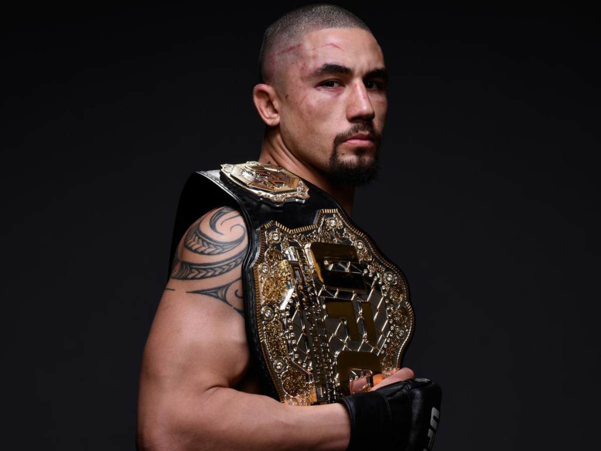 Robert Whittaker with the UFC belt